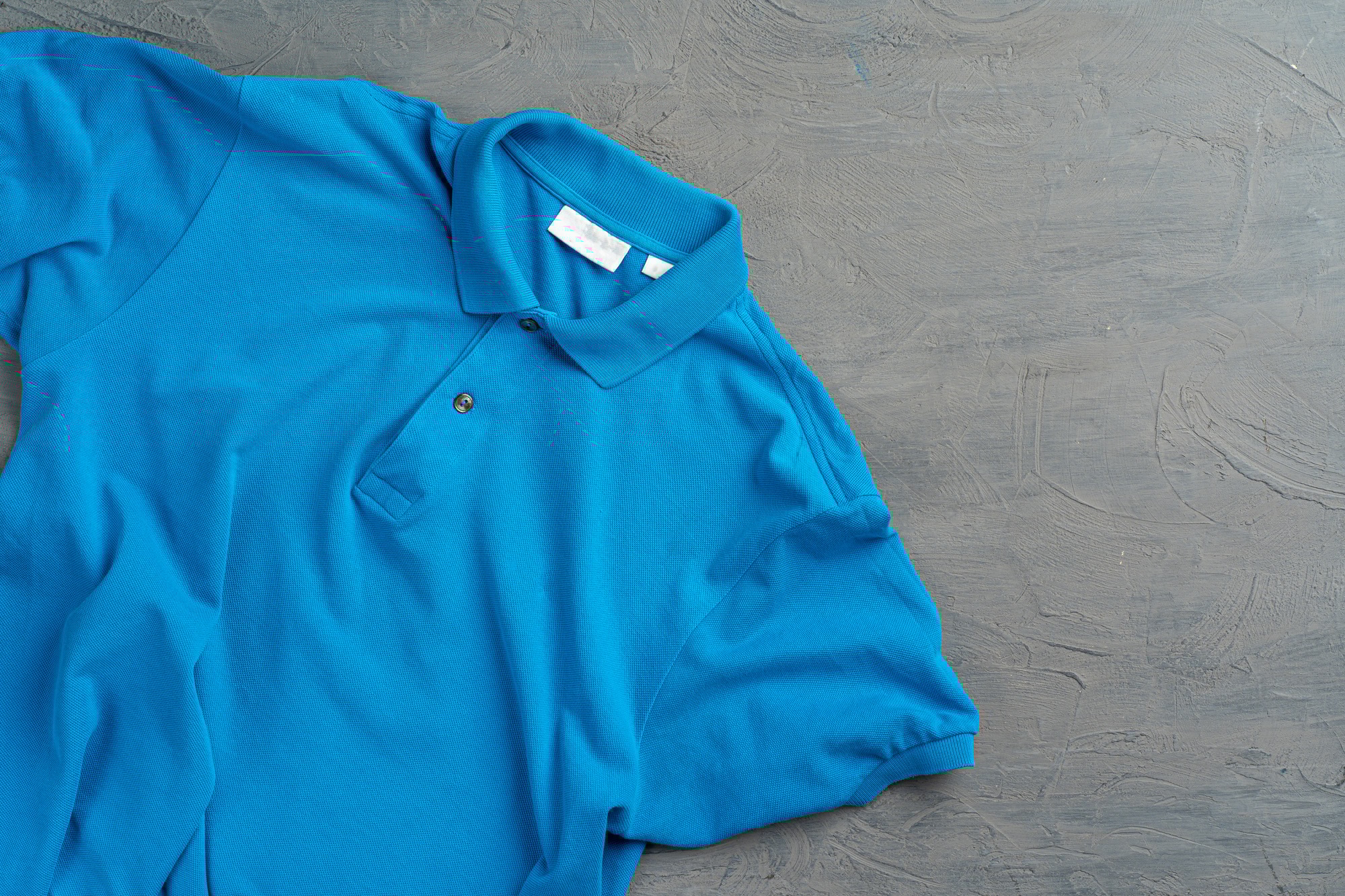 Blue cotton polo t-shirt texture close up