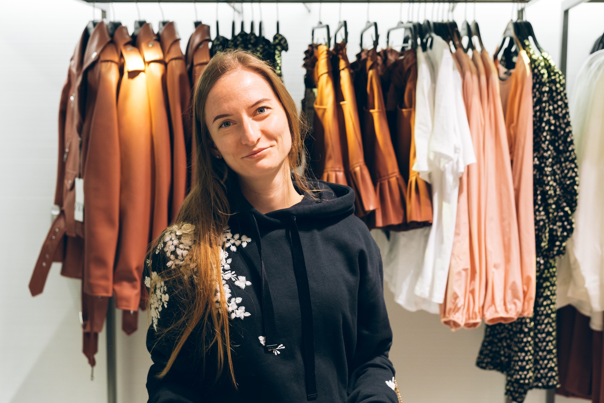 Smiling young woman portrait shopping trendy clothes